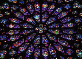 Colorful stained glass window in Notre Dame Cathedral (Religion) glass window,rosette,church window